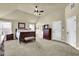 Spacious main bedroom with neutral walls, large bed, and ample closet space at 4315 Balsam Bark Dr, Cumming, GA 30028