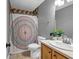 Clean bathroom featuring vanity with granite counters and a tiled shower at 5485 Shirewick Ln, Lithonia, GA 30058