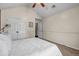 This bedroom features neutral cream walls, wall to wall carpet, and a double door closet at 5485 Shirewick Ln, Lithonia, GA 30058