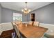 Elegant dining room featuring chandelier lighting, rug, and seating for six at 5485 Shirewick Ln, Lithonia, GA 30058
