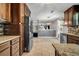 Well-lit kitchen with stainless steel appliances, tile backsplash, and granite countertops at 5485 Shirewick Ln, Lithonia, GA 30058