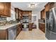 Well-lit kitchen with stainless steel appliances and granite countertops at 5485 Shirewick Ln, Lithonia, GA 30058