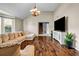 Bright living room featuring vaulted ceilings, hardwood floors, and neutral paint colors at 5485 Shirewick Ln, Lithonia, GA 30058