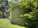 Exterior of home with green vinyl siding and cinder block foundation at 590 Killian Road Rd, Canton, GA 30114