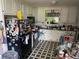 Kitchen with white cabinets, black appliances and checkered floors at 590 Killian Road Rd, Canton, GA 30114