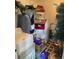 This functional laundry room features a washer, dryer, storage shelves, and checkered floors at 590 Killian Road Rd, Canton, GA 30114