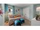 Charming bedroom with light blue walls, a daybed, and whimsical decor at 221 Paisley Way, Locust Grove, GA 30248