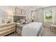 Bedroom with a white nightstand and decor at 221 Paisley Way, Locust Grove, GA 30248
