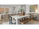 Elegant dining room with a white table, decorative vases, and stylish chairs at 221 Paisley Way, Locust Grove, GA 30248