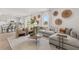 Comfortable living room with large sectional, natural light and modern décor at 221 Paisley Way, Locust Grove, GA 30248