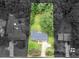 Aerial view of the residence and property line, showcasing the ample green space with mature trees at 4720 Hull Rd, Conyers, GA 30094