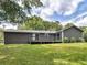 Home's exterior showing a backyard with deck and lush green lawn at 4720 Hull Rd, Conyers, GA 30094