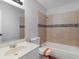 A bathroom featuring a shower over the tub, a mirror, and a sink at 4720 Hull Rd, Conyers, GA 30094