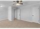 Spacious bedroom with light gray walls, carpet, and fan at 4720 Hull Rd, Conyers, GA 30094