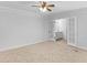 Large bedroom with plush carpet and a full bathroom off to the side at 4720 Hull Rd, Conyers, GA 30094