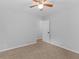 Neutral bedroom with plush carpet, ceiling fan, and light gray walls at 4720 Hull Rd, Conyers, GA 30094