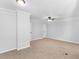 Spacious bedroom with light gray walls, carpet, and fan at 4720 Hull Rd, Conyers, GA 30094