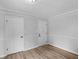 This bedroom features light gray walls and new wood flooring at 4720 Hull Rd, Conyers, GA 30094