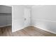 A well-lit bedroom features light gray walls and wood flooring at 4720 Hull Rd, Conyers, GA 30094