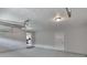 Two car garage with bright lights, showing the interior with neutral paint at 4720 Hull Rd, Conyers, GA 30094
