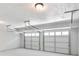 A spacious two car garage with bright lighting and white doors at 4720 Hull Rd, Conyers, GA 30094
