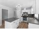 Well-lit kitchen featuring stainless appliances, white cabinets, and a center island at 4720 Hull Rd, Conyers, GA 30094