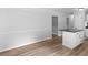 Bright kitchen with gray countertops, a center island, and wood-look floors at 4720 Hull Rd, Conyers, GA 30094