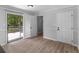 Kitchen featuring sliding glass doors, white cabinetry, access to an outdoor deck at 4720 Hull Rd, Conyers, GA 30094