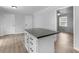 Bright kitchen featuring a functional island with drawers and granite countertops at 4720 Hull Rd, Conyers, GA 30094