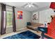Relaxing rec room featuring a gaming console, a blue rug, and playful art on the walls at 3229 Dunlin Lake Rd, Lawrenceville, GA 30044