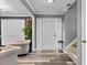 Welcoming entryway boasts wood-look flooring, neutral paint and convenient access to the living room at 3229 Dunlin Lake Rd, Lawrenceville, GA 30044