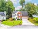 Charming two-story home with a brick and white exterior, landscaped yard, and attached garage at 3229 Dunlin Lake Rd, Lawrenceville, GA 30044