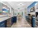 Bright kitchen features stainless steel appliances, custom cabinetry and white countertops at 3229 Dunlin Lake Rd, Lawrenceville, GA 30044