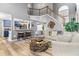 Bright living room boasts tall ceilings, gray walls, wood floors, and open access to the kitchen at 3229 Dunlin Lake Rd, Lawrenceville, GA 30044