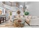 Bright living room boasts tall ceilings, gray walls, wood floors, and a unique coffee table at 3229 Dunlin Lake Rd, Lawrenceville, GA 30044