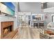 Open-concept living room with fireplace, dining area, and kitchen view at 3229 Dunlin Lake Rd, Lawrenceville, GA 30044