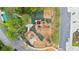 Aerial view of a large wooden playground structure with swings, slides and green park at 4130 Stonecypher Rd, Suwanee, GA 30024