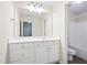 Bathroom featuring large vanity, and a door to a separate toilet and shower at 4130 Stonecypher Rd, Suwanee, GA 30024