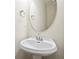 Bathroom features a pedestal sink with brushed nickel fixtures and an oval mirror at 4130 Stonecypher Rd, Suwanee, GA 30024