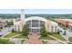 City Hall featuring a clock tower, fountains, American flags, manicured lawns, trees and benches at 4130 Stonecypher Rd, Suwanee, GA 30024