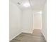 Hallway with modern flooring, neutral paint, and recessed lighting creates a clean, bright space at 4130 Stonecypher Rd, Suwanee, GA 30024