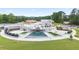 Modern water feature and park with a waterfall, stage, and landscaped seating area for public enjoyment at 4130 Stonecypher Rd, Suwanee, GA 30024