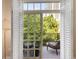 Private balcony with seating, lush greenery, and views of the building's cityscape at 1055 Piedmont Ne Ave # 401, Atlanta, GA 30309