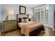 Bedroom featuring a luxurious bed, light-blue walls, and lots of natural light at 1055 Piedmont Ne Ave # 401, Atlanta, GA 30309