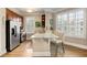 Charming kitchen with stainless steel appliances, wood cabinets, granite countertops, and a breakfast bar at 1055 Piedmont Ne Ave # 401, Atlanta, GA 30309
