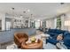 Open floor plan with living room, kitchen island, and dining area featuring hardwood flooring and neutral colors at 1055 Piedmont Ne Ave # 401, Atlanta, GA 30309