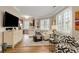 Open floor plan featuring a kitchen and a bright and sunny seating area with hardwood flooring at 1055 Piedmont Ne Ave # 401, Atlanta, GA 30309