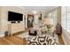Bright open floorplan between kitchen and living room with hardwood flooring and neutral decor at 1055 Piedmont Ne Ave # 401, Atlanta, GA 30309