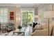 Cozy living room with shutters, a balcony, and stylish decor offer relaxation and natural light at 1055 Piedmont Ne Ave # 401, Atlanta, GA 30309