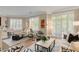 Bright living room features hardwood floors, shutters on the windows and a neutral color palette at 1055 Piedmont Ne Ave # 401, Atlanta, GA 30309